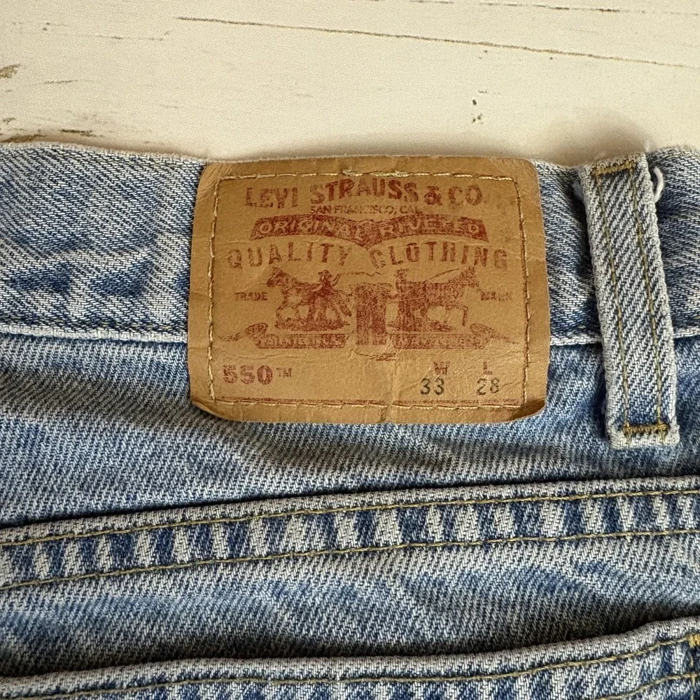Vintage Levi's 550 Relaxed Tapered Jeans Student Fit 10 Husky 33X28 Light Wash